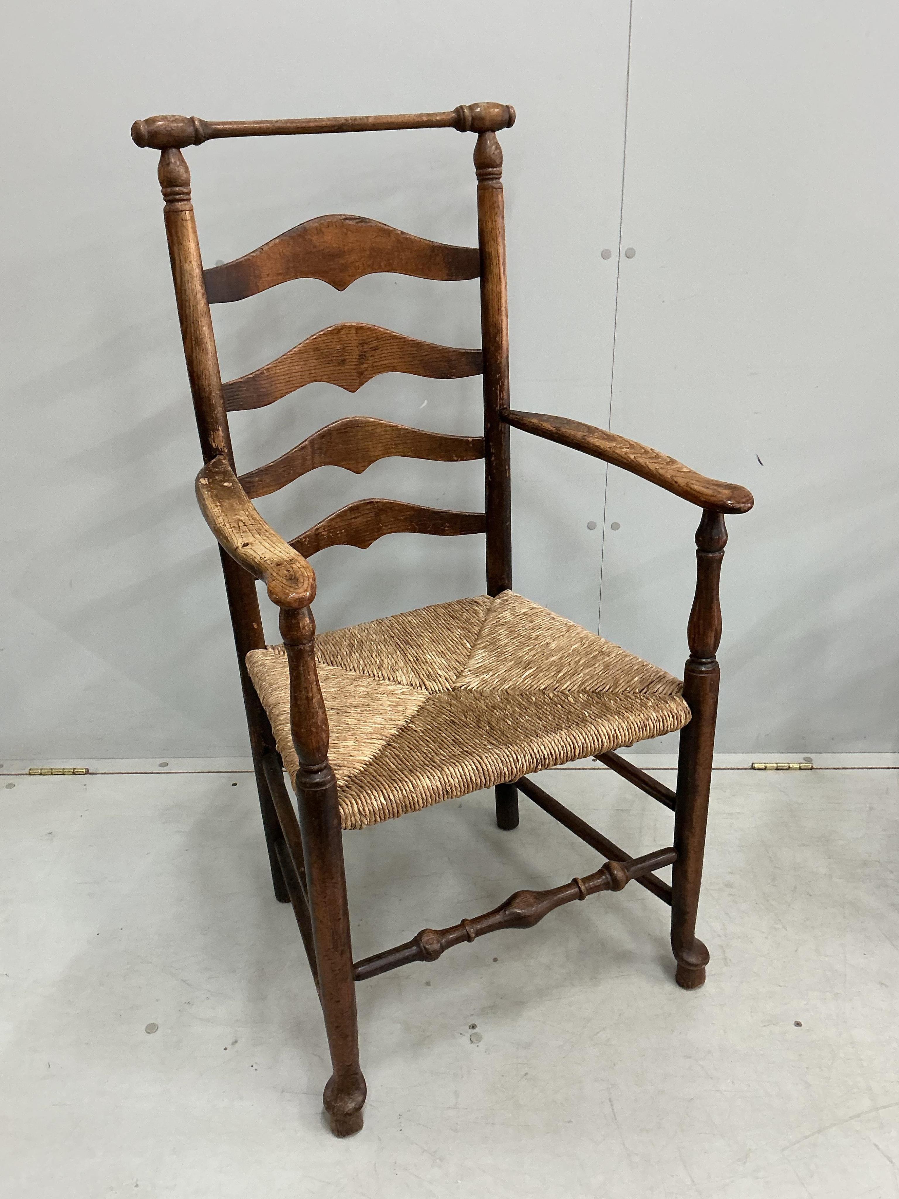 A harlequin set of eight 18th century ash ladderback rush seat dining chairs, two with arms